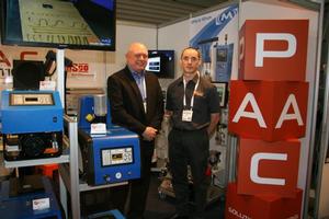 Queensland's PAC Solutions' director Norman Clarke (right) and Herb Penner from Valco Menton at PAC's stand at AUSPACK PLUS 2013.